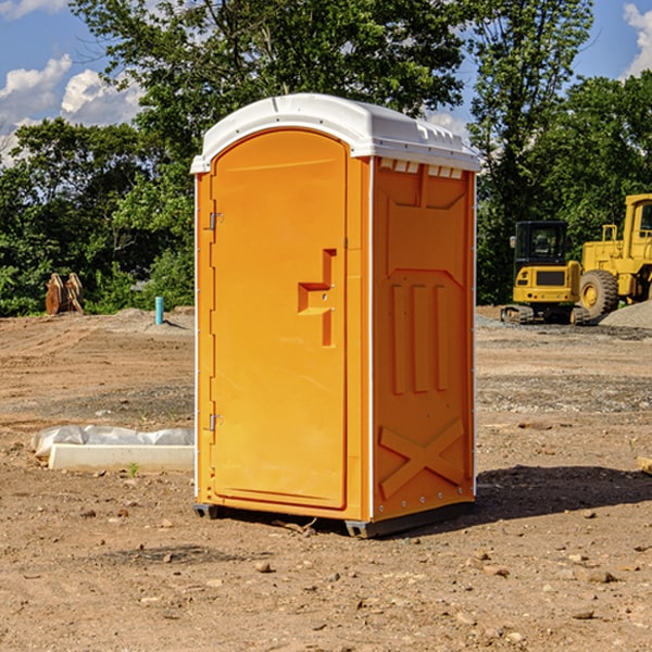 what is the cost difference between standard and deluxe portable restroom rentals in Buckland